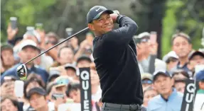  ?? CHUNG SUNG-JUN/GETTY IMAGES ?? Tiger Woods recovered from three bogeys on his first three holes to shoot 64 in the Zozo Championsh­ip in Japan on Thursday.