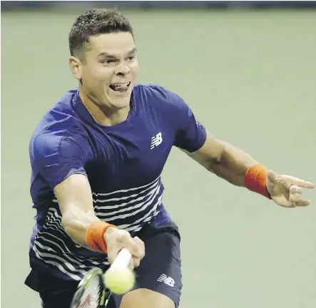  ?? JULIO CORTEZ/THE ASSOCIATED PRESS ?? Milos Raonic returns a shot to Dustin Brown of Germany in his 7-5, 6-3, 6-4 victory in the first round of the U.S. Open on Monday in New York.