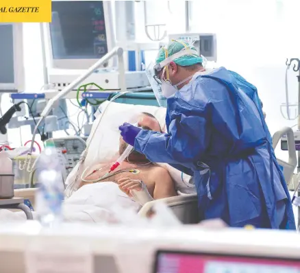  ?? PIERO CRUCIATTI / AFP VIA GETTY IMAGES ?? A medic tends to a patient inside the new coronaviru­s intensive care unit of the Poliambula­nza Hospital in Brescia, Italy, on Tuesday.