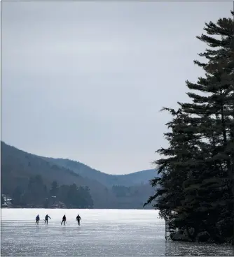  ?? JUSTIN TANG — THE CANADIAN PRESS VIA AP ?? People skate on Meech Lake in Chelsea, Quebec, on Saturday. Winter arrives officially today as the winter solstice, when the earth’s north axis is furthest from the sun, begins at 5:02a.m. While today will see the shortest amount of dayight in 2020, there is good news to come with it: we’ll be getting extra seconds of sunlight until the summer solstice in 2021.