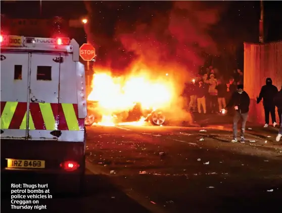  ??  ?? Riot: Thugs hurl petrol bombs at police vehicles in Creggan on Thursday night