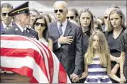  ?? ASSOCIATED PRESS ?? Former Vice President Joe Biden (center) watches an honor guard carry the casket of his son, Beau Biden, who died of glioblasto­ma in 2015.
