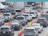  ?? WILFREDO LEE - THE ASSOCIATED PRESS ?? Vehicles wait in line at a drive-thru COVID-19 testing site outside Hard Rock Stadium, Wednesday, July 8, 2020, in Miami Gardens, Fla. Florida is one of the nation’s hot spots for coronaviru­s. Almost 10,000 confirmed cases were added Wednesday, bringing its total since March 1 to nearly 224,000. Almost 4,000 people have died, including 48 reported by the state Wednesday.