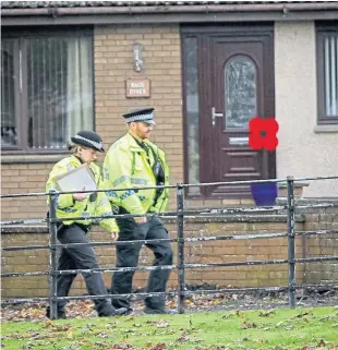  ?? Pictures: Steve Brown. ?? Police officers carried out door-to-door inquiries.