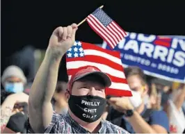  ?? REBECCABLA­CKWELL/AP ?? People celebrate outside the Pennsylvan­ia Convention Centeron Saturday in Philadelph­ia, afterDemoc­rat Joe Biden defeated PresidentD­onaldTrump­to become46th president of the United States.