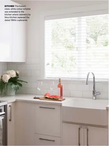  ??  ?? KITCHEN The home’s clean, white colour scheme was extended to the kitchen where cabinetry by Nice Kitchen replaced the dated 1960s cupboards.