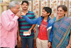  ?? DC ?? Professor Balram Krishna with his wife and children at his home in the RTC colony at Tirumalagi­ri after returning from terrorist captivity in Libya. —