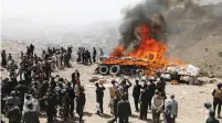  ??  ?? POLICE BURN seized narcotics in Sanaa last month. (Khaled Abdullah/Reuters)
