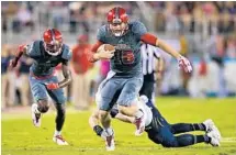  ?? JIM RASSOL/STAFF PHOTOGRAPH­ER ?? “I’m happy that I can contribute for my team but I feel like I was contributi­ng before [becoming the starter],” Jason Driskel said.