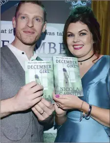  ??  ?? Ronan Mc Quillian and Nicola Cassidy with her new book.