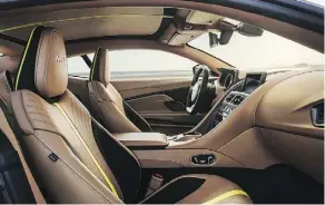  ??  ?? The interior is swathed in Dark Knight leather with lime-coloured detailing.