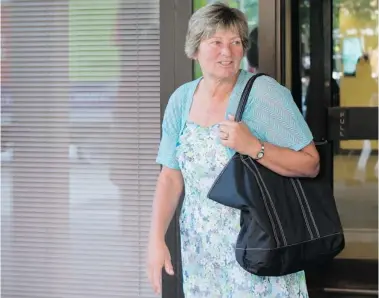  ?? MATTHEW SHERWOOD/Postmedia News ?? Michelle Bridgen, a former manager at the Grand Valley Institutio­n for Women, leaves the Coroners Courts in Toronto after
testifying at the Ashley Smith inquiry on Wednesday.