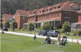  ?? Liz Hafalia / The Chronicle ?? The Presidio’s Main Post lawn is still open. The park is cutting 20% of its staff.