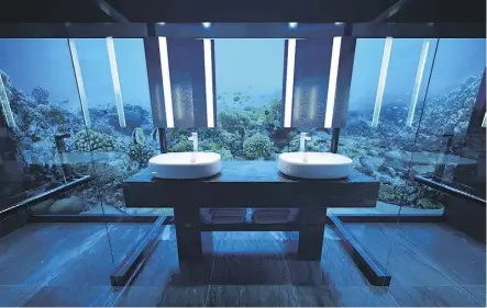  ?? PHOTOS: CONRAD MALDIVES RANGALI ISLAND ?? You may feel like you’re in a fishbowl in the suite’s bathroom.