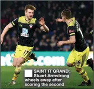  ??  ?? ■
SAINT IT GRAND: Stuart Armstrong wheels away after scoring the second