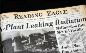  ?? PHOTO BY JEREMY DREY ?? “N-Plant Leaking Radiation” the headline of the Reading Eagle, an afternoon paper at the time, on Wednesday, March 28, 1979, the day of the event. Front pages of the Reading Eagle and Reading Times the day and following day of the Three Mile Island nuclear meltdown.