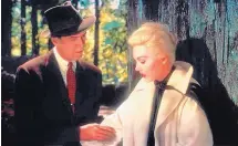  ?? COURTESY OF UNIVERSAL STUDIOS ?? Jimmy Stewart, left, comforts Kim Novak in a scene from Alfred Hitchcock’s 1958 film ‘Vertigo.’ In 2012, ‘Vertigo’ displaced ‘Citizen Kane’ as the top film on the Sight & Sound critics’ poll.