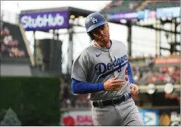  ?? JACK DEMPSEY – THE ASSOCIATED PRESS ?? The Dodgers' Freddie Freeman scores a first-inning run against the Rockies on Tuesday.