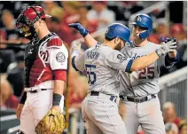  ?? TOMMY GILLIGAN / REUTERS ?? Celebració­n. Los Dodgers vencieron 10-4 a Nacionales y estan cerca de ganar la serie.