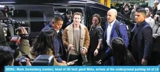  ?? -- AFP ?? SEOUL: Mark Zuckerberg (center), head of US tech giant Meta, arrives at the undergroun­d parking lot of LG Twin Tower during his visit to South Korea on the second leg of his Asia trip in Seoul on Feb 28, 2024.