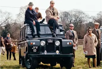  ??  ?? Royal wheels: Anne, Andrew and Philip on a Land Rover at Badminton in 1969