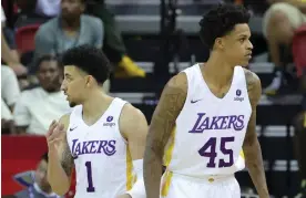  ?? ?? Scotty Pippen Jr, left, and Shareef O'Neal of the Los Angeles Lakers stand on the court during a Summer League game against the Phoenix Suns last week at the Thomas & Mack Center in Las Vegas, Nevada. Photograph: Ethan Miller/Getty Images,