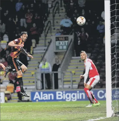  ?? PICTURE:JONATHAN GAWTHORPE ?? SOLE GOAL: Rory McArdle’s beautifull­y-timed run and leap saw him score the only goal of the night, for Bradford City.