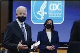  ?? PATRICK SEMANSKY — THE ASSOCIATED PRESS ?? President Joe Biden speaks as Vice President Kamala Harris listens during a COVID-19 briefing at the headquarte­rs for the Centers for Disease Control and Prevention in Atlanta on Friday.