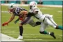  ?? WILFREDO LEE - THE ASSOCIATED PRESS ?? Miami Dolphins defensive back Ken Webster (31) tackles New England Patriots wide receiver Julian Edelman (11), during the first half at an NFL football game, Sunday, Sept. 15, 2019, in Miami Gardens, Fla.