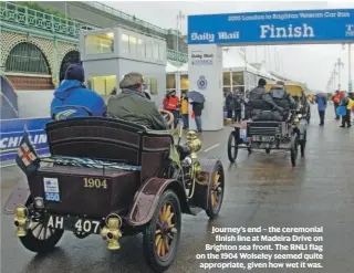  ??  ?? Journey’s end – the ceremonial finish line at Madeira Drive on Brighton sea front. The RNLI flag on the 1904 Wolseley seemed quite appropriat­e, given how wet it was.