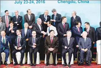  ??  ?? G20 Finance Ministers and Central Bank Governors prepare for a group photo session in Chengdu in southweste­rn China’s Sichuan province, July 24. Participan­ts in the front row are (from left), World Bank President Jim Yong Kim, an unidentifi­ed member,...