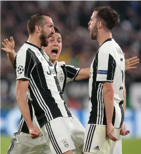  ??  ?? Juve’s Giorgio Chiellini, left, celebrates a goal against Barca