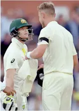  ??  ?? Australia's batsman Steve Smith (L) exchanges words with England paceman Stuart Broad (R) on the first day of the second Ashes Test match in Adelaide - AFP