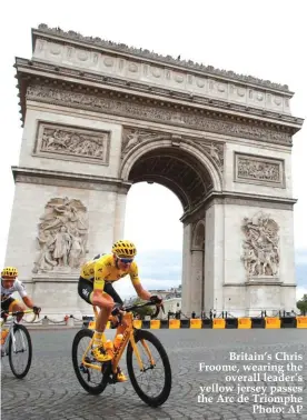  ??  ?? Britain’s Chris Froome, wearing the overall leader’s yellow jersey passes the Arc de Triomphe Photo: AP