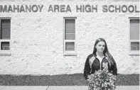  ?? DANNA SINGER/ ACLU ?? This undated image shows student cheerleade­r Brandi Levy in front of Mahanoy Area High School in Mahanoy, Pennsylvan­ia. The U.S. Supreme Court court ruled that her profanity-laden social media post was protected by free speech rules.