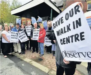  ??  ?? Campaigner­s outside the walk in centre in 2013