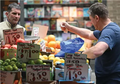 ?? AFP ?? Analysts say that the pound in the pocket is going to continue to buy British shoppers less in current circumstan­ces
