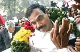  ?? IANS ?? Former Telecom Minister A. Raja is greeted by supporters as he comes out of the Patiala House Court in New Delhi on 21 December, 2017. The court acquitted all the accused in the alleged 2G scam.