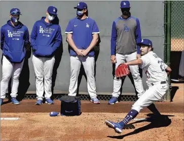  ?? Wally Skalij Los Angeles Times ?? TREVOR BAUER, warming up before his unofficial Dodgers debut, had his fastball sit between 89 and 94 mph in a short appearance. Said Bauer, “I’m looking forward to when the games matter and I get those butterf lies.”