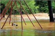  ?? PHOTO SUBMITTED BY LORI ROHRBACH ?? Floodwater­s from Hay Creek swamp a playset in Birdsboro’s Rustic Park on Monday, Aug. 13.