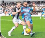  ??  ?? Cammy Smith and Dundee’s Steven Caulker