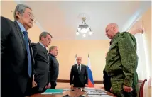  ?? PHOTO: AP ?? Russian President Vladimir Putin, centre, longtime Kemerovo regional Governor Aman Tuleyev, left, presidenti­al envoy to the Siberian Federal District Sergei Menyailo, second left, Emergency Situations minister Vladimir Puchkov, third left, and...