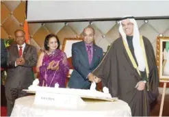  ??  ?? KUWAIT: Assistant Foreign Minister for Asia Affairs Ambassador Ali Al-Saeed and Indian Ambassador to Kuwait Sunil Jail cut the ceremonial cake.
— Photos by Joseph Shagra and KUNA