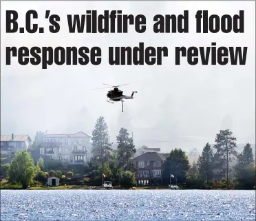  ?? Herald file photo ?? A helicopter loaded with water from Skaha Lake takes off to battle a July 2017 wildfire in Kaleden. Premier John Horgan announced Monday a review of the province’s response to last summer’s unpreceden­ted flood and fire seasons.
