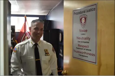  ?? NICHOLAS BUONANNO — MEDIANEWS GROUP ?? Watervliet Police Chief Anthony Geraci stands in front of the procedural justice sign on his office door.
