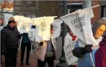  ??  ?? Those seeking common sense gun reform solutions marked the fiveyear anniversar­y of the Sandy Hook Elementary School shooting and carried T-shirts with the names and ages of victims along Market Street in West Chester on Sunday.