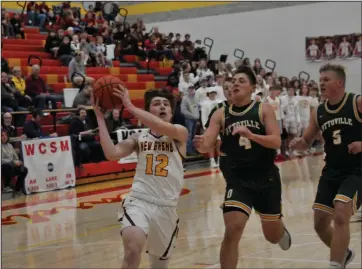  ?? Staff photo/Mike Frank ?? New Bremen’s Nick Alig goes up for a layup last week in the Cardinals first game of the season against Ottoville.