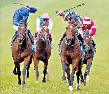  ??  ?? Power play: Ryan Moore on Churchill (right) goes clear of Blue Point as he lands the Dubai Dewhurst Stakes yesterday