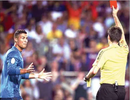  ??  ?? Centre Referee Ricardo de Burgos Bengoetxea (right) sending Cristiano Ronaldo away from the Spanish Super Cup Clasico …on Sunday night