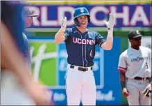  ?? PHOTO COURTESY OF UCONN ATHLETICS ?? Mike Chiovitti of UConn claps after doubling in the AAC tournament final against Cincinnati on Sunday at St. Petersburg, Fla.